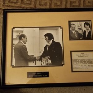 A Framed Black And White Photo of Elvis Presley and President Nixon.
